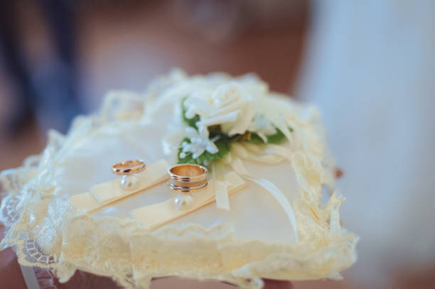 istock Two wedding rings on the pillow 859775278