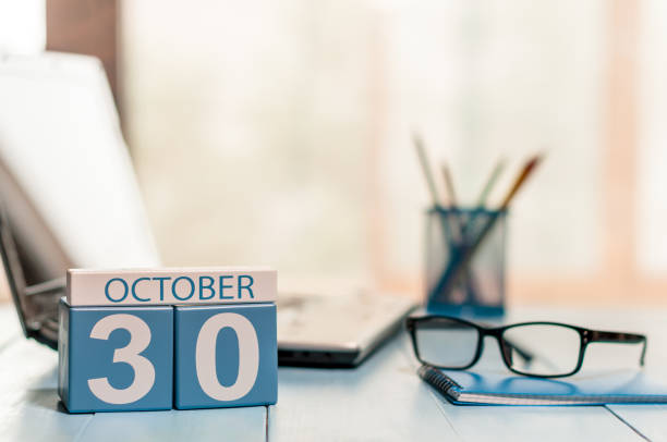 istock October 30th. Day 30 of month, calendar on white-collar worker workplace background. Autumn fall. Empty space for text 859776280