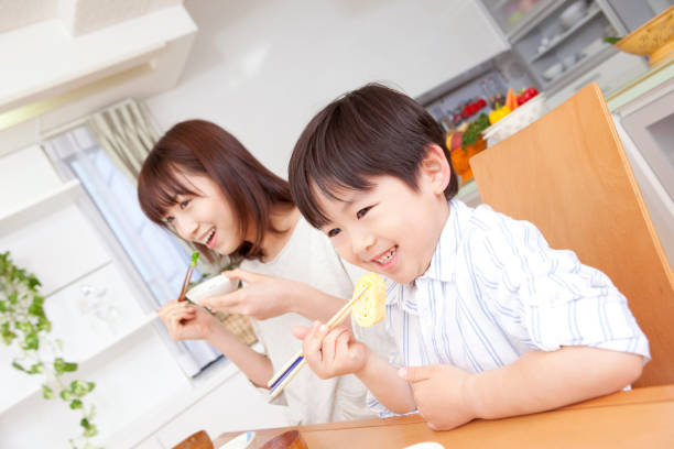 istock Boys try to eat fried eggs at breakfast time 859779818