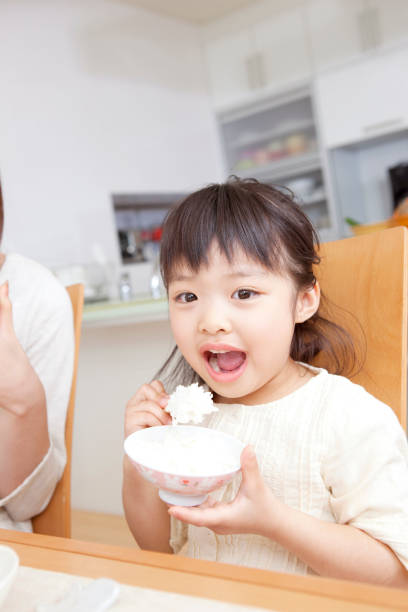 istock Girl eating 859780294