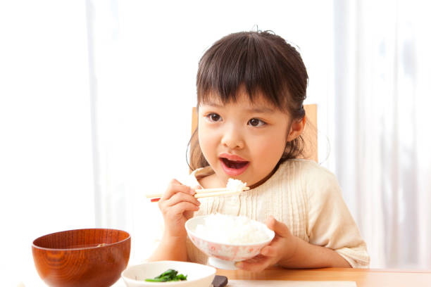 istock Girl eating 859780470