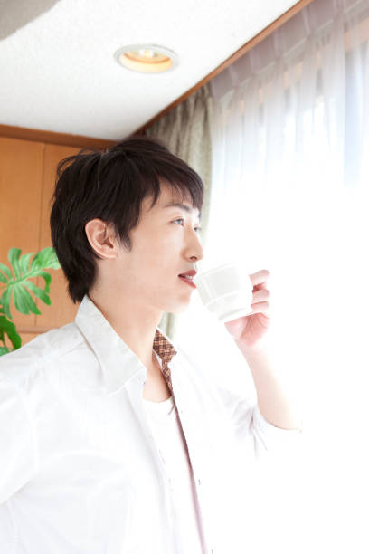 istock Men drink milk at breakfast time 859783316
