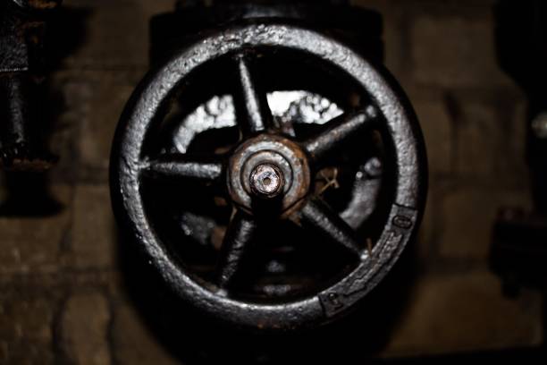 Large metal valve in the heating system on a water pipe of black color