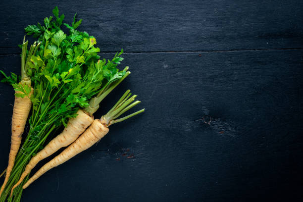 istock Parsley. Root parsley. On a wooden background. Top view. Free space for text. 859787904