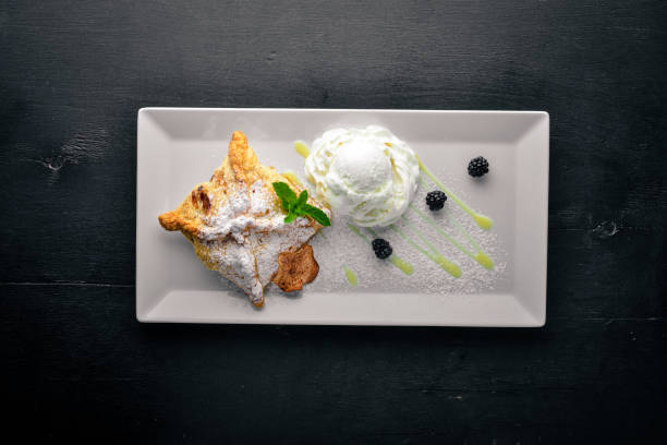 istock Apple Strudel with Ice Cream. On a wooden background. Top view. Free space for text. 859788150