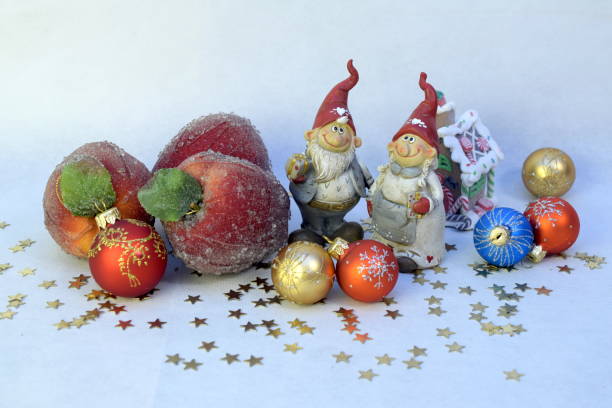 istock Two gnomes, apples and balls. 859788588