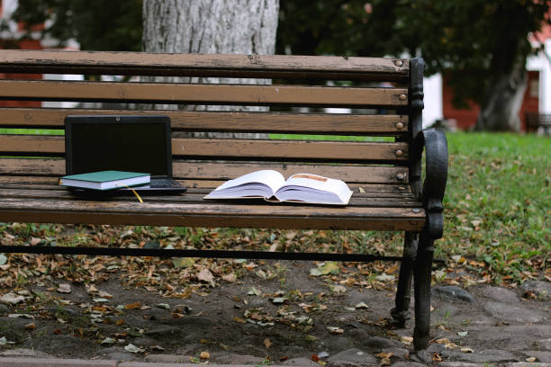 istock books on a bench in the school year 859794842