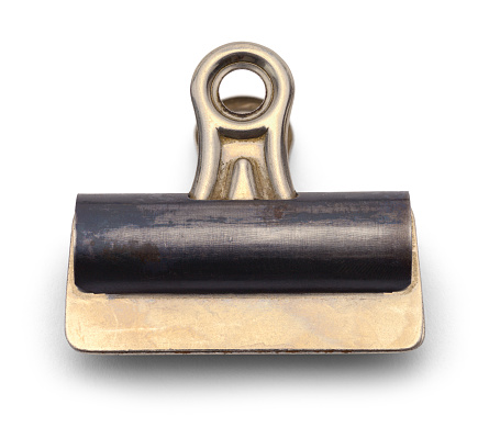 Old Large Metal Binder Clip Isolated on a White Background.