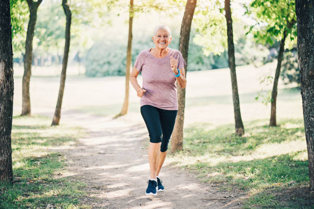 istock Senior woman jogging in the park 859807026