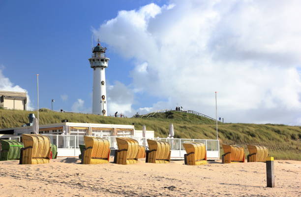 Lighthouse and Beach in Egmond aan Zee. North Sea, the Netherlands. stock photo