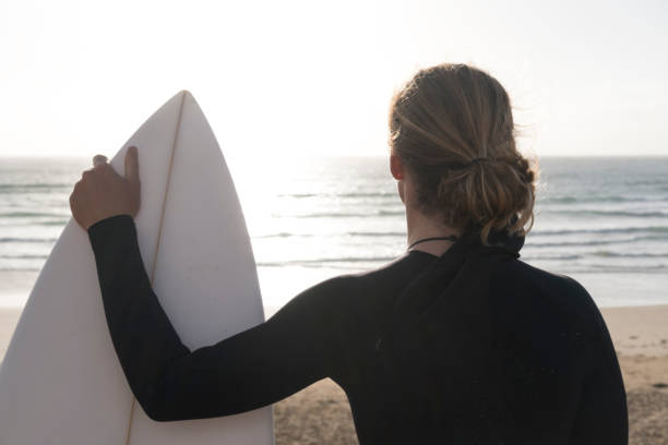 istock Surfer looking out over the coast before a surf. 859816426