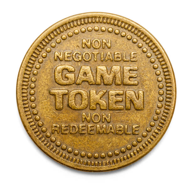 Game Token Arcade Video Game Token Isolated on White Background. token photos stock pictures, royalty-free photos & images