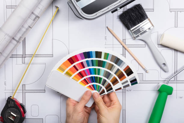 istock An Architect Holding Color Guide Swatch On Blueprints 859829734