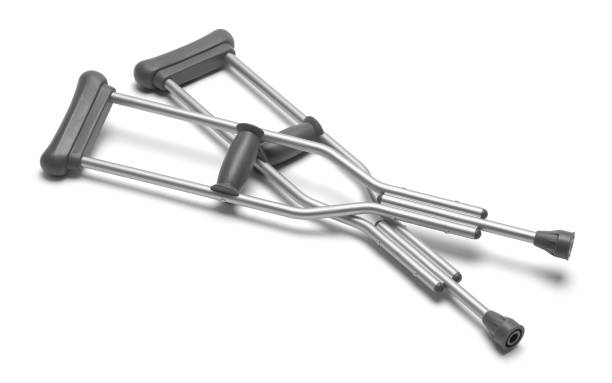 Crutches Pair of Crutches Isolated on a White Background. crutch stock pictures, royalty-free photos & images