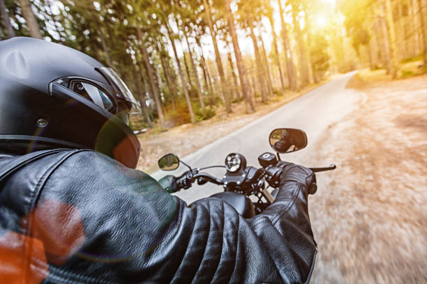 istock Man seat on the motorcycle on the forest road 859834216