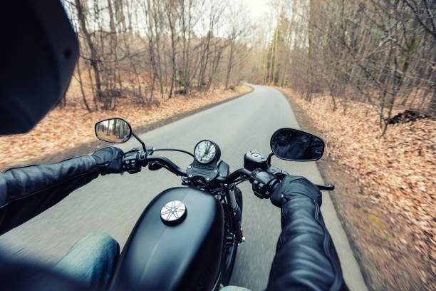istock Man seat on the motorcycle on the forest road 859834522