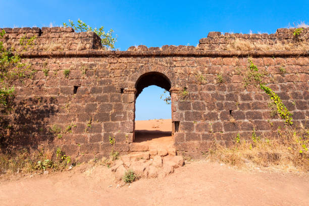 Chapora Fort in Goa Chapora Fort entrance gate. Fort is located in north Goa, rises high above the Chapora River, India. chapora fort stock pictures, royalty-free photos & images
