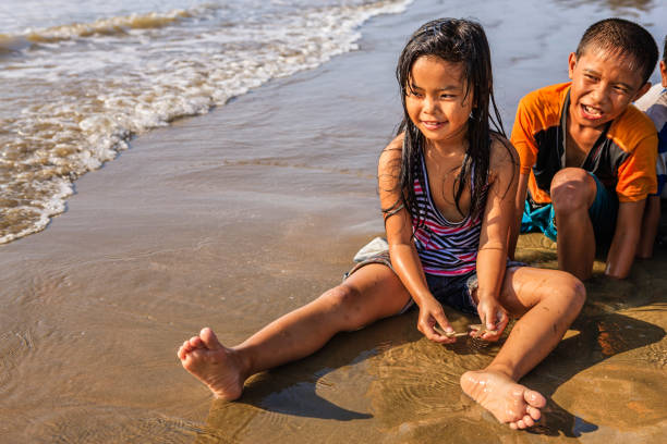 istock Vietnamese children playing on the beach, Vietnam 859849124