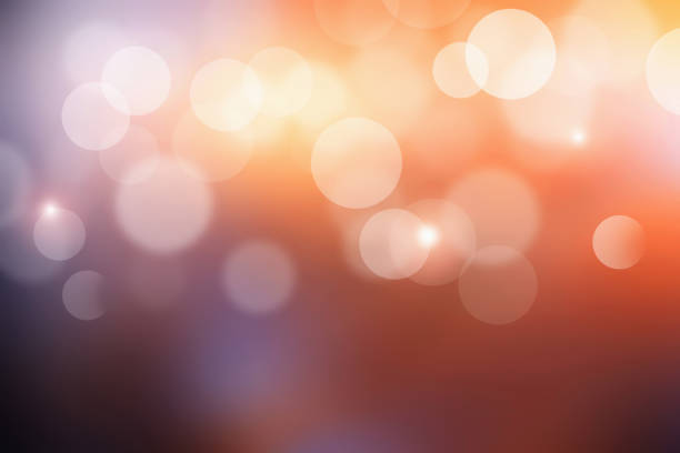 Bokeh sunlight with abstract blur orange lights. Sunset background.