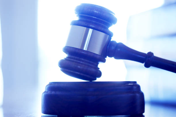 istock A Gavel Rests On Its Sounding Block In Front Of Stack Of Law Books 859853198
