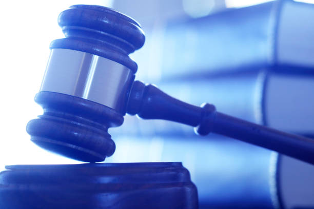 istock A Gavel Rests On Its Sounding Block In Front Of Stack Of Law Books 859853214