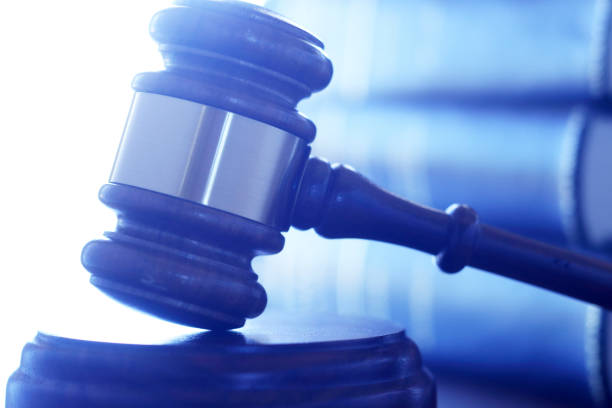 istock A Gavel Rests On Its Sounding Block In Front Of Stack Of Law Books 859853224