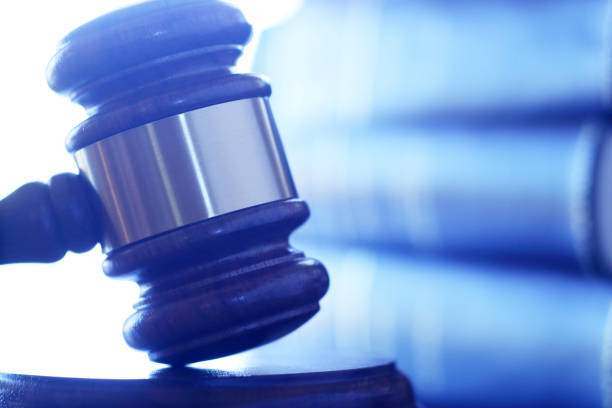istock A Gavel Rests On Its Sounding Block In Front Of Stack Of Law Books 859853304
