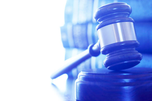 istock A Gavel Rests On Its Sounding Block In Front Of Stack Of Law Books 859853364