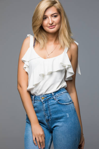 istock Smiling female model fashion posing isolated on grey background 859870116