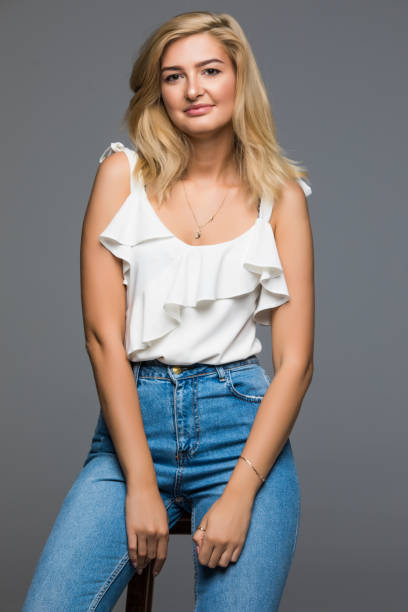 istock Smiling female model fashion posing isolated on grey background 859870740