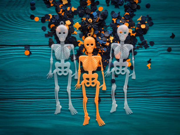 istock Halloween party decorations skeleton on dark green 859874452