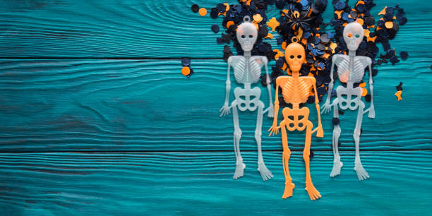 istock Halloween party decorations skeleton on dark green 859874480