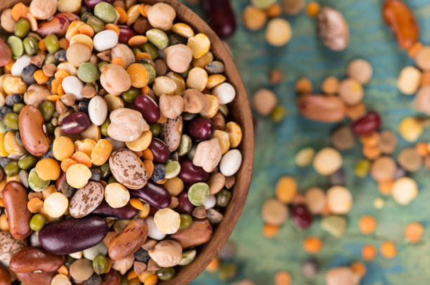istock Raw legume on old rustic wooden table 859875316