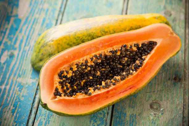 Fresh papaya on wooden background
