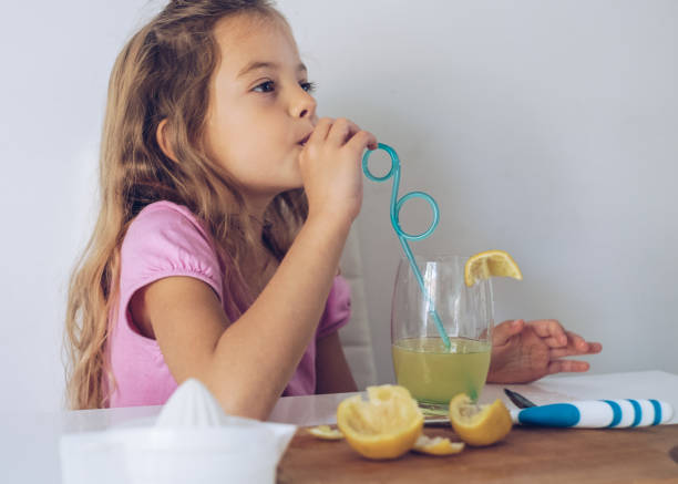 istock Girl drinking juice 859879116