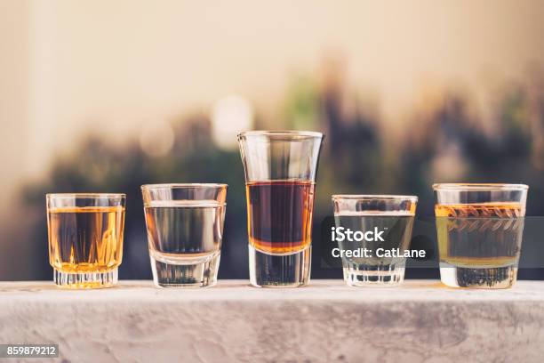 Five Shot Glasses Filled With A Variety Of Alcohol Stock Photo - Download Image Now - Tequila - Drink, Alcohol - Drink, Tasting