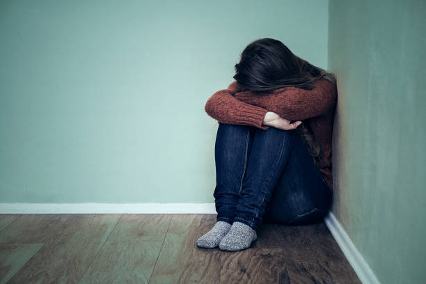 istock Depression woman sit on the floor 859879690
