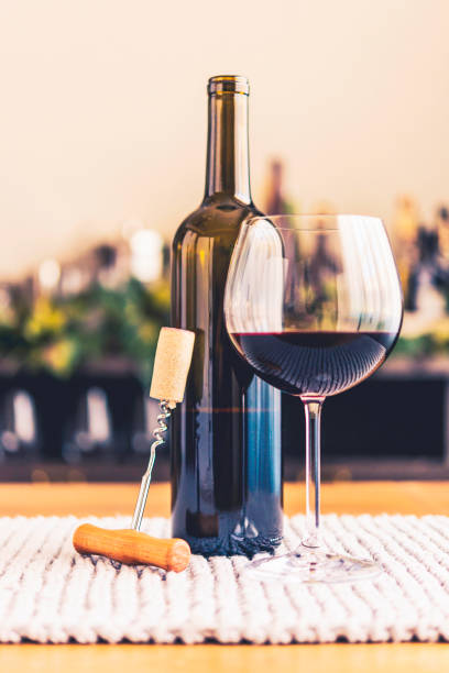 istock Wine tasting theme with bottle and glass of red wine 859882670
