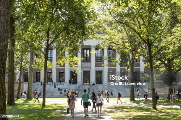 Students And Tourists Rest In Lawn Chairs In Harvard Yard The Open Old Heart Of Harvard University Campus Stock Photo - Download Image Now