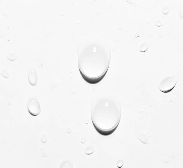 istock drops of water on white. close-up 859886908