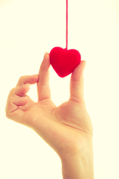 istock Female hand with little heart. 859887042