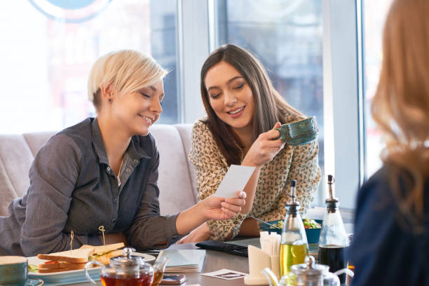 istock Happy women having good time in cafe 859896712
