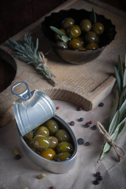 istock Olives on wooden table aged with little light 859900532