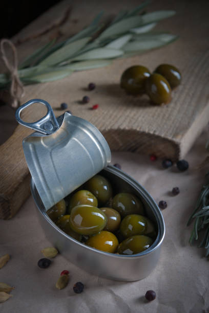 istock Olives on wooden table aged with little light 859900580