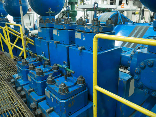 Triplex mud pumps for oil drilling rig in the pump room Triplex mud pumps for oil drilling rig in the pump room duplex photos stock pictures, royalty-free photos & images