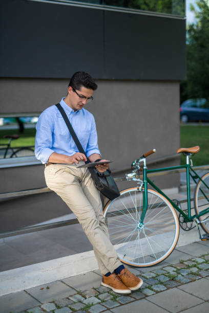 istock Young businessman using tablet outdoor 859916374
