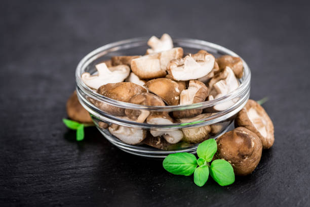 istock Portion of Raw Shiitake mushrooms on a slate slab 859925184