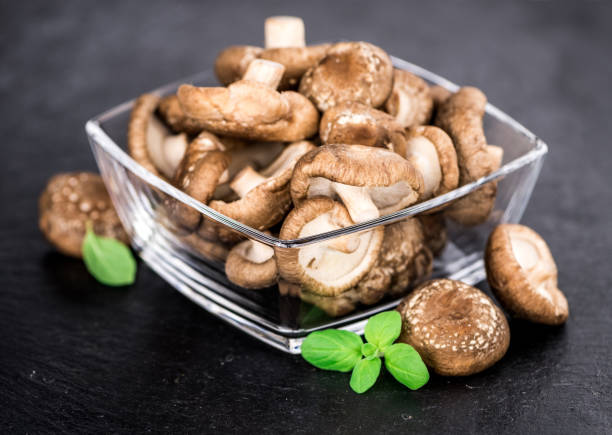 istock Portion of Raw Shiitake mushrooms on a slate slab 859925722