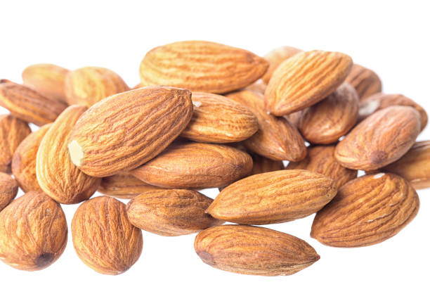 istock Almonds on white background, close up, isolated on white 859930254