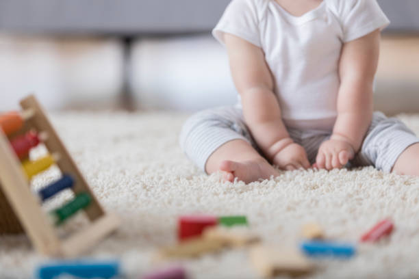 istock Unrecognizable plays on the floor at home 859936620
